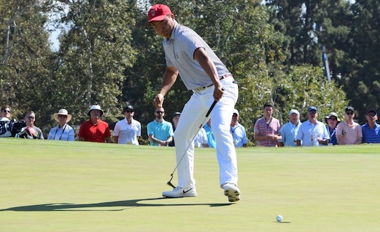 Norman Xiong is pumped after holing a birdie putt on No. 16<br>right on top of Paul McBride's huge par save for GB&I (Wlodkowski, AGC)