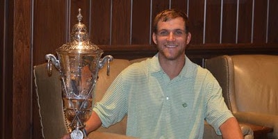Christian Sease sits with Carolinas Amateur trophy <br>(Carolinas Golf Association Photo)</br>