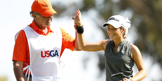 Isabella Fierro celebrates with her caddie on the way to upending<br>local favorite Haley Moore in the round of 16 (USGA photo)