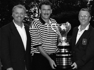 Gene Elliott with the 1998 Porter Cup trophy