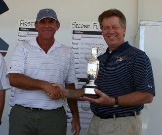 Accepts trophy from Chander Mayor Boyd Dunn