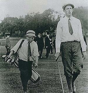 Shown here in the legendary photo with caddy Eddie Lowery
