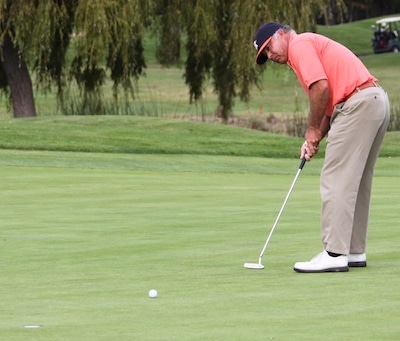 36-hole leader Brady Exber putts for birdie on No. 13