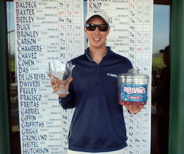 Jonny Baxter exercising an AmateurGolf.com<br>tradition; holding up Red Vines with his winning trophy