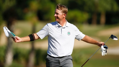 Schmitz reacts to his hole-in-one on the 33rd hole<br>USGA photo