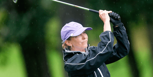 Dana Harrity pairs through the rains drops on Monday <br>(USGA Photo)