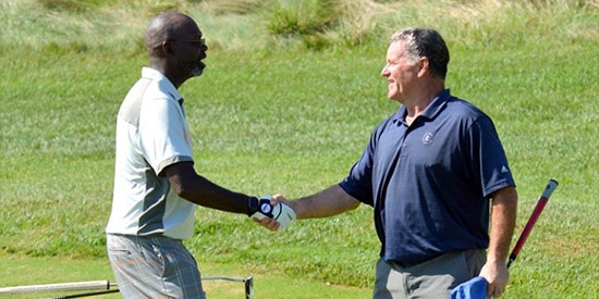 Duncan Hardcastle (L) congratulations Rich Buckner (R) for<br>winning the final match in the 70th Virginia Senior Amateur