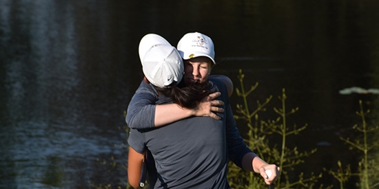 Emilia Migliaccio and Dylan Kim celebrate their win (Arnold Palmer Cup photo)
