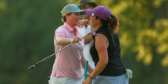 Kelsey Chugg (left) hugs Julia Potter-Bobb (USGA photo)