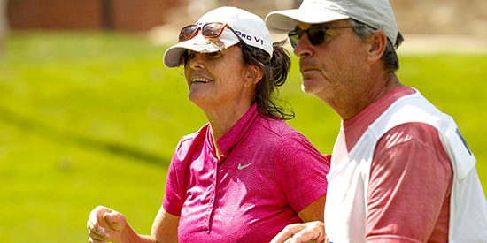 Sue Wooster with her husband and caddie (USGA/Steve Gibbons)