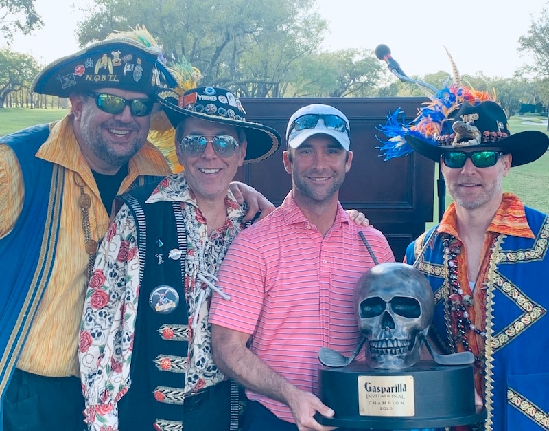 Spared by pirates - Derek Busby poses with some salty dogs and his Gasparilla trophy