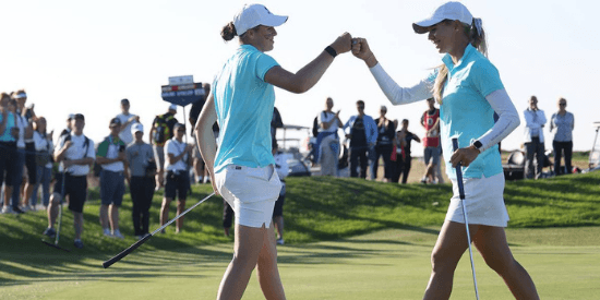Hannah Darling and Annabell Fuller of GB&I celebrate their four-ball win over Rachel Heck and Emilia Migliaccio. (R&A)