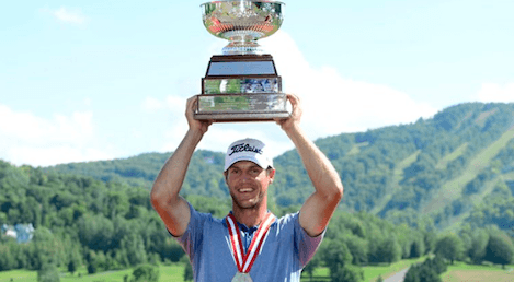 Garrett Rank hoists Canadian Mid-Amateur trophy <br>(Charles Laberge/ Golf Canada Photo)