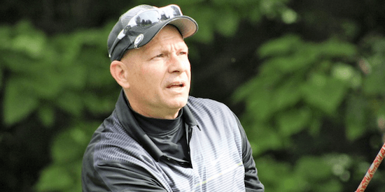 Brian Miller watches a shot on his way to the title <br>(GAM Photo)