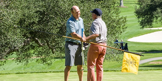 Craig Calkins (left) receives a handshake from Brady Exber (Photo submitted)