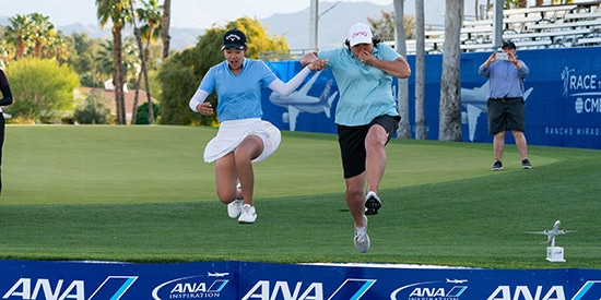 Pat Hurst (right) joins Cindy Kou for a dip in Poppie's Pond (Kelly Kline / ANA)