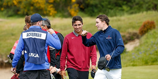 Derek Ackerman, in red, with partner Matthew McCarty, right (USGA/Steve Gibbons)
