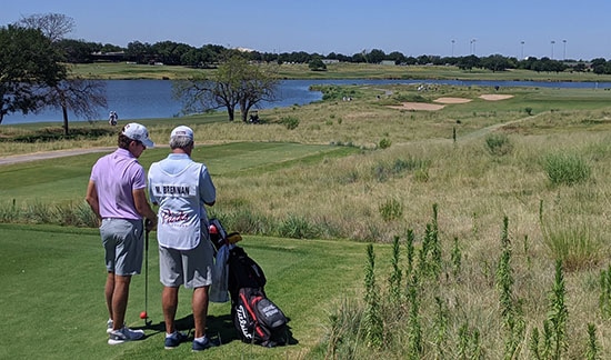 Michael Brennan and caddie on a browned-out Maridoe GC (Ryan Frazer/Agora Golf photo)