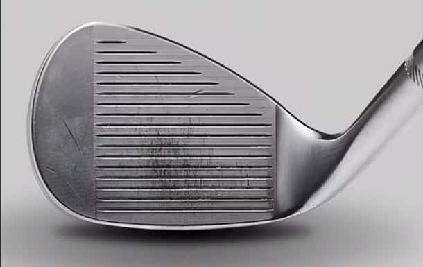 A wedge face showing groove wear in the impact zone.