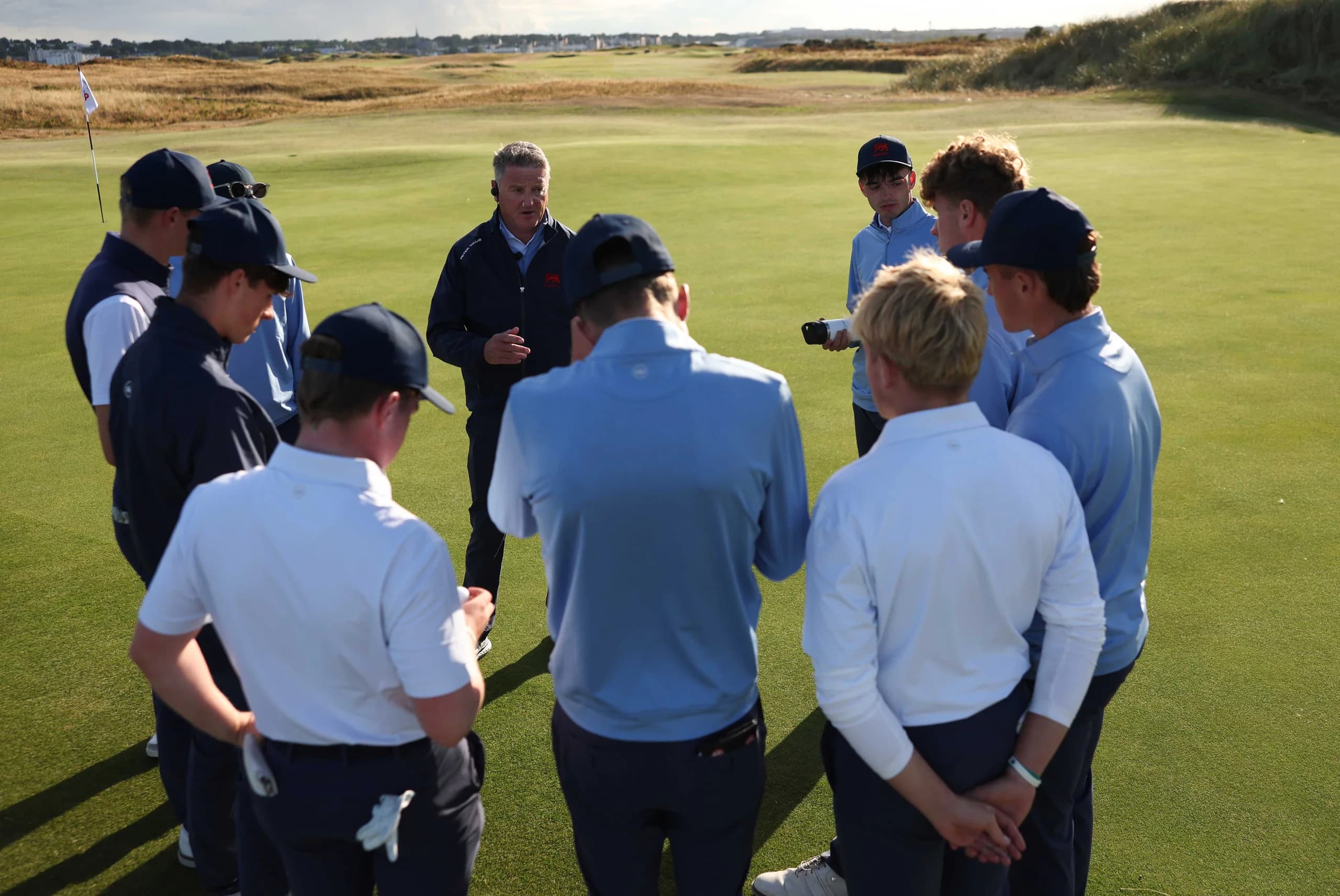 GB&I captain Niall MacSweeney gathers his team for a huddle after the opening day of the Jacques Léglise Trophy.