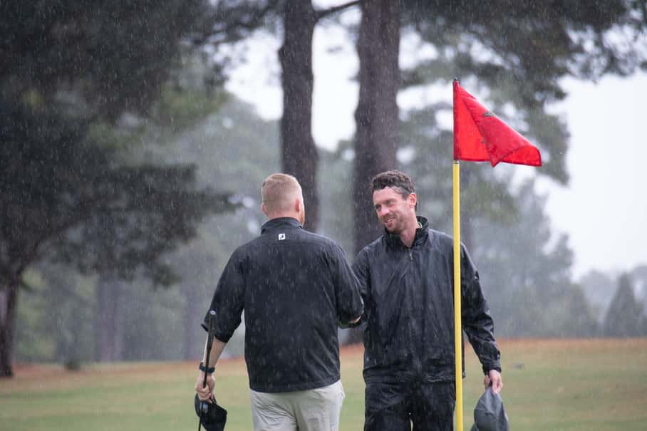 Peter Bowie, right, and Cam Roam shake hands after their match ended in a tie