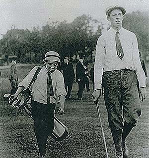 Shown here in the legendary photo with caddy Eddie Lowery