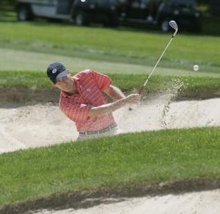 Jeff Putman of Winged Foot Golf Club hits out of a bunker<br>during the championship match in the Anderson Memorial.<br>(Ricky Flores/The Journal News)
