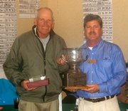 Riverwood’s PGA Head Professional,<br>Bob Ridge right, presents the Riverwood<br>Senior Invitational trophy to Bill Zylstra