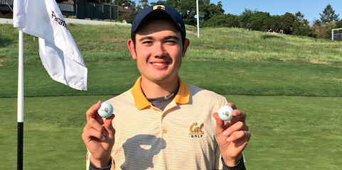 Cal's William Aldred holds his two hole-in-one golf balls <br>(Photo Courtesy of Kyle McRae, Cal Athletics)