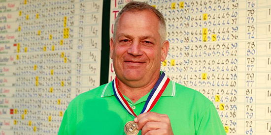David Brown sports his medal for topping the 156-<br>man field in stroke play qualifying (USGA photo)