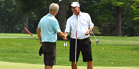 Glenn Smeraglio (R) finished play long before<br>he could accept the trophy (GAP photo)