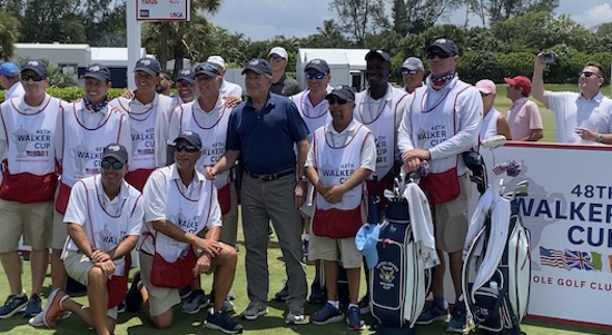 Former President George W. Bush poses with Team USA<br>caddies on Friday at Seminole Golf Club (AmateurGolf.com photo)