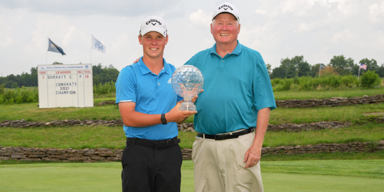 Caleb Surratt and his grandfather Brad with the Junior PGA Championship trophy