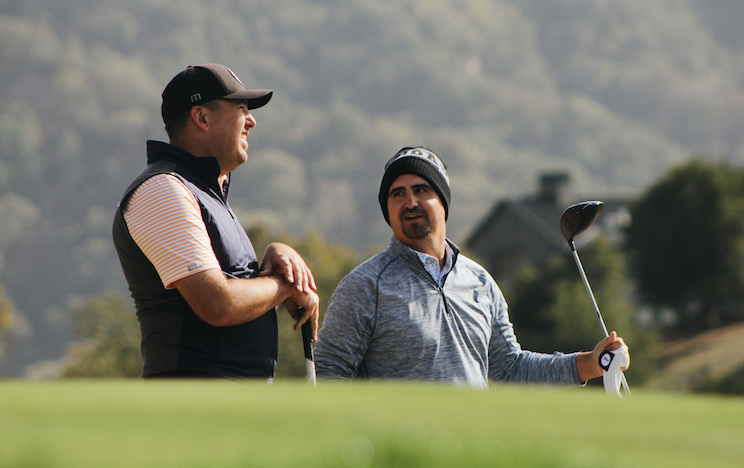Geoff Gonzalez and Brian Blanchard share a laugh while waiting on the 17th tee box. (Conner Penfold/AmateurGolf.com)