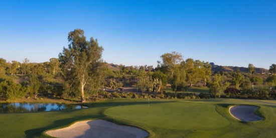 Cactus-framed fairway with Bradshaw Mountains in the background
